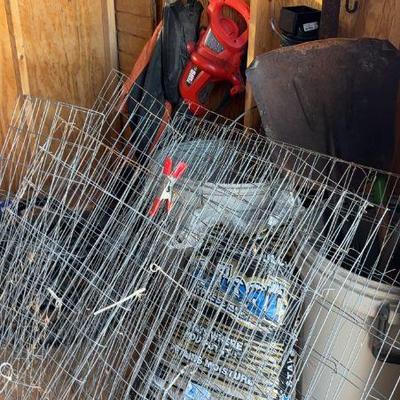 Shed clear out: plastic garbage can, mulch, rakes, shovels, ax, Black & Decker blower, chicken wire