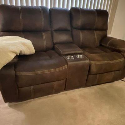 Brown leather reclining sofa