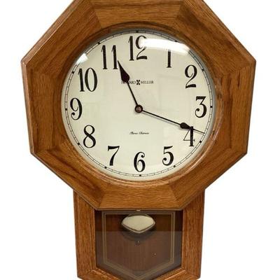 ANDE103 Howard Miller Wall Clock	Natural oak wood color. Needs new batteries. Measures approximately 21" tall 13.5" wide. Comes...