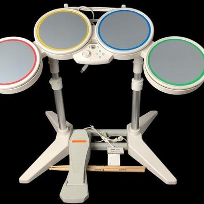 BEBO636 Wii RockBand Drums And Accessories	This lot includes the Wii Rockband drum set, foot stand, original drum set and cords. 
