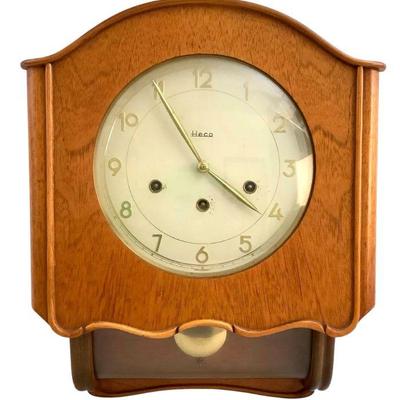 BEBO224 Vintage Heco Germany Wall Clock	Made in Germany, comes with the pendulum and key. 
