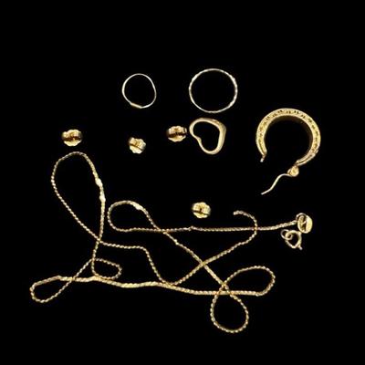 BEBO904 An Assortment Of Stamped 14K Gold Scrap Pieces	A total of 3.25 grams of stamped 14K gold scrap pieces.
