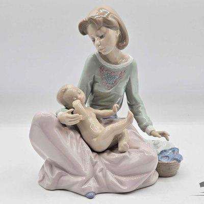 #2266 • Lladró Dressing the Baby Porcelain Sculpture
