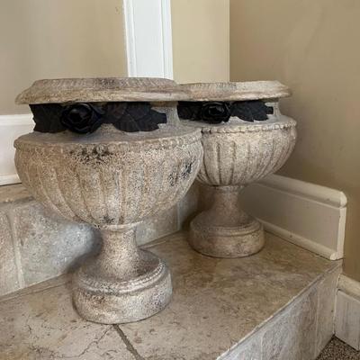 A pair of planter urns