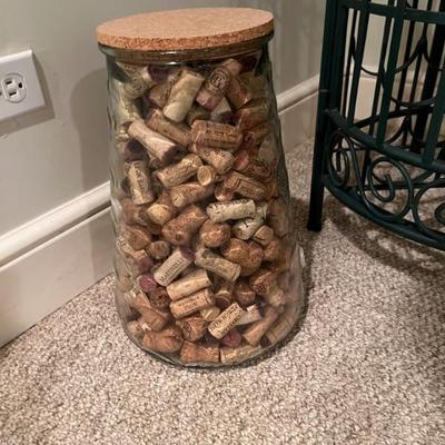 Large decorative jar filled with wine corks