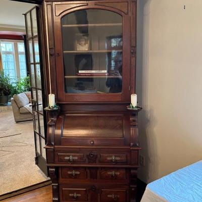 Tall late 19th century secretary desk with glass hutch and drawers, plus little shelves for candlesticks in gorgeous condition