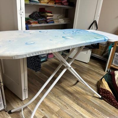 A room full of quilting supplies, fabrics, tools, finished quilted items and more!!