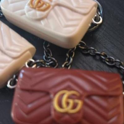 Gucci Chanel and Louis Vuitton keychains