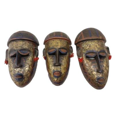 SET OF WOOD MASKS WITH BRASS