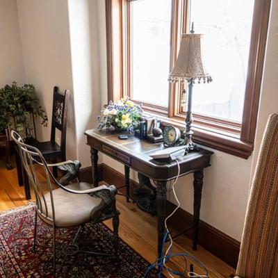 WRITIND DESK $200 WROUGHT IRON CHAIR  LEATHER SEAT (chair sold )BOOK ENDS $24LAMP $20