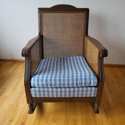 55 antique cane back arm panel rocking chair