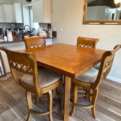 Elevated dining table that extends to a circle