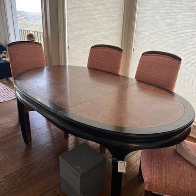 Table has a leaf and four chairs