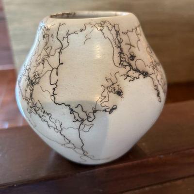 Pottery white jar with gold design