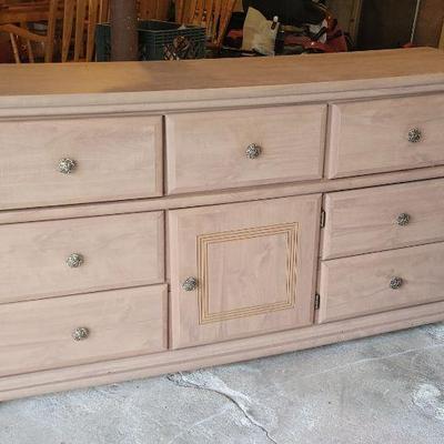 Wood dresser.  Light colored.
61" X 31"