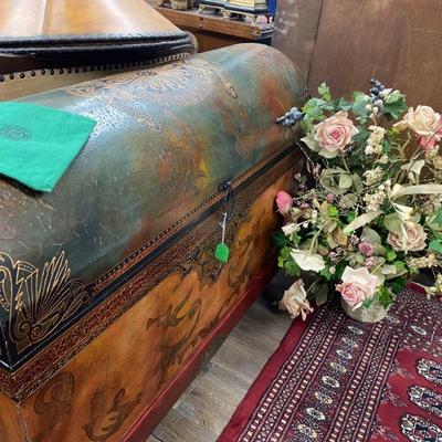 Round dome shaped hand painted chest and floral arrangements throughout shop