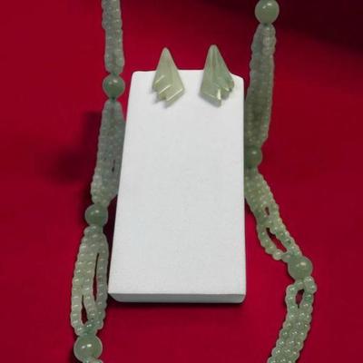 Jadeite bead strand complementing earrings