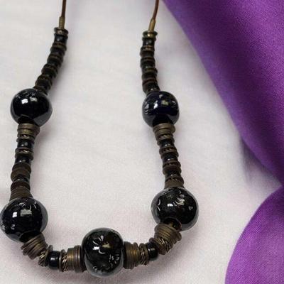 Bold statement necklace with earthy ethnic influences