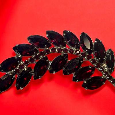 Ruby red leaf shaped brooch