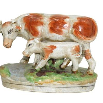 STAFFORDSHIRE POTTERY COW AND CALF