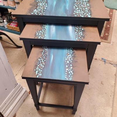 River runs through nested tables handpainted