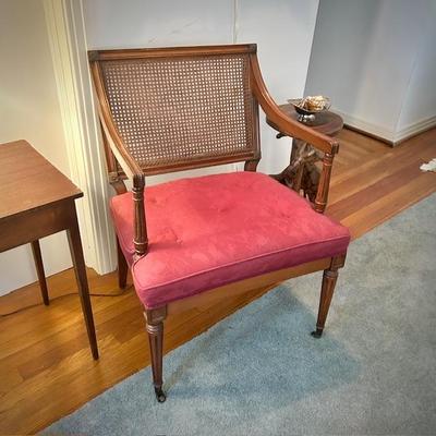One of two vintage mid-century caned chair