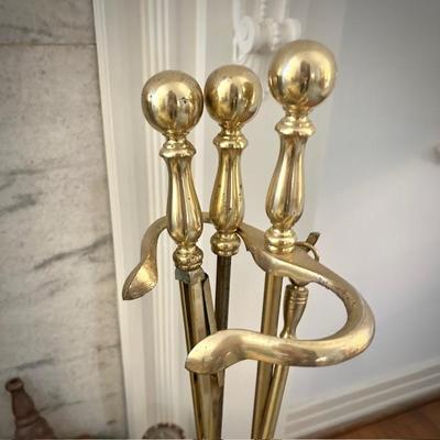 Vintage brass fireplace bumper, andirons and tools