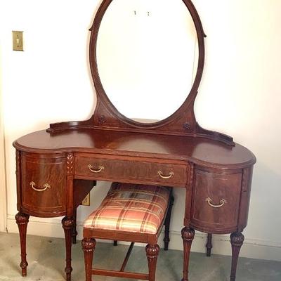 1930’s carved walnut dressing table and bench purchased at John Wannamakers, NY. This is a quality piece of furniture.