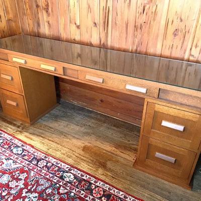 Custom made 3 pc. quarter sawn oak credenza s/ glass top. 7’ long, 20” deep, 32”ht.