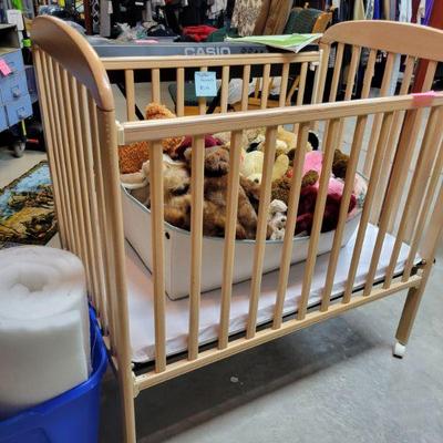 Crib and Stuffed Aminals