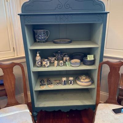 sold blue bookcase. pottery still avail
