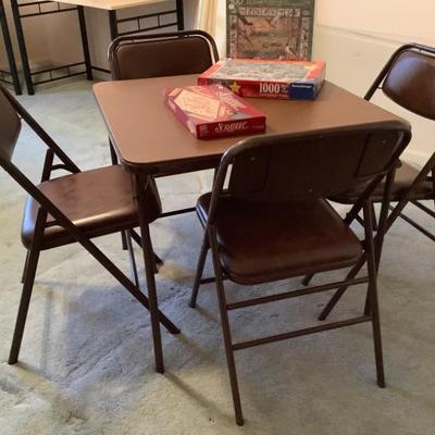 Sold $50 Samsonite folding table and 4 chairs