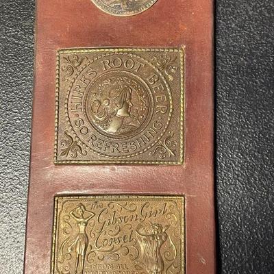 BRASS PLAQUES ON LEATHER