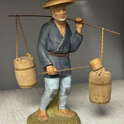 Japanese water carrier porcelain figurine