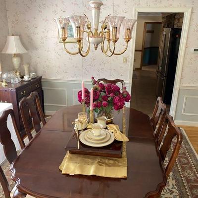 The dining table is 64" long with two leaves each 16" wide (only one leaf has been locate thus far)

Ethan Allen