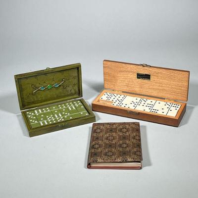(3pc) DOMINO SETS & BOOK | Including: hand carved wood domino box engraved “Silverado Invitational 1973”, green painted domino box...