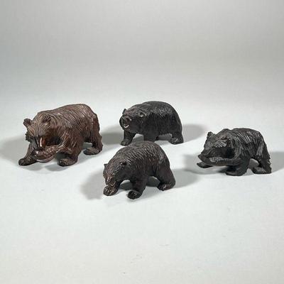 (4pc) CARVED BEAR FIGURINES | Including: brown bear with fish, black bear with fish, and 2 other carved wood bear figures. - h. 3.5 x w....