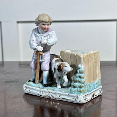 PORCELAIN SPILL VASE | Boy with dog glazed porcelain spill vase with gilt accent, with impressed stamp marks on the bottom - h. 4.5 x w....