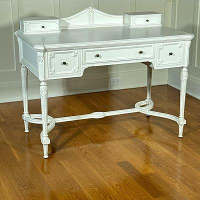 Lady’s Writing Desk | White painted writing desk with three frieze drawers over carved legs and a shaped stretcher, with two desktop...