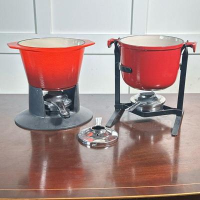 LE CREUSET FONDUE POTS | Including two Le Creuset fondue pots with stands and adjustable burners - h. 8.5 x w. 7 x l. 8.5 in

