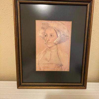 Framed "Portrait of an English Woman with Hat and Coat" by Hans Holbein the Younger.