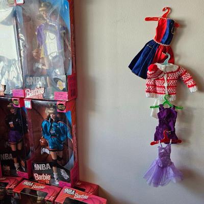 LOTS of Barbie dolls, Barbie clothes & accessories. Most are still new in box. Other dolls & accessories as well.