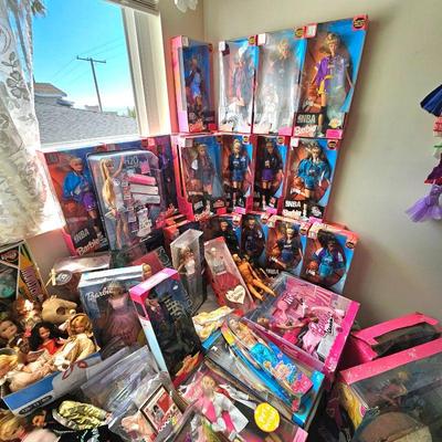 LOTS of Barbie dolls, Barbie clothes & accessories. Most are still new in box. Other dolls & accessories as well.