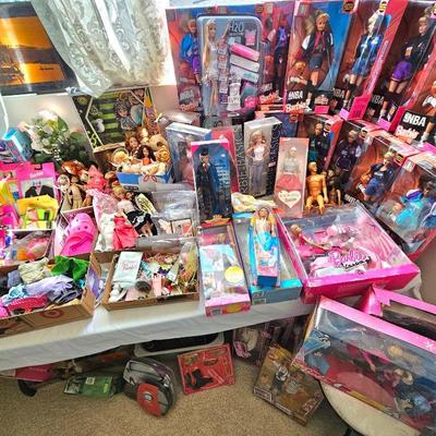 LOTS of Barbie dolls, Barbie clothes & accessories. Most are still new in box. Other dolls & accessories as well.