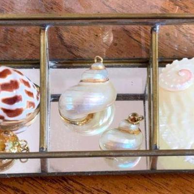 Shell pendants embellished with gold
