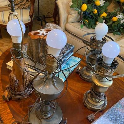 large collection of antique table lamps