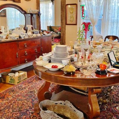 Antique Cherrywood Dining Room table with 4 leaves and 10 chairs loaded with china and pottery