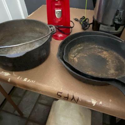 assortment of cast iron skillets