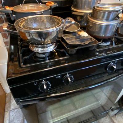 Amana Gas Stove with Revereware pots and pans and Goliath copper lined large cooking pot with lid