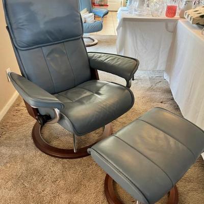 Pair of 1990s Ekornes Stressless recliners in slate blue leather both with matching ottomans